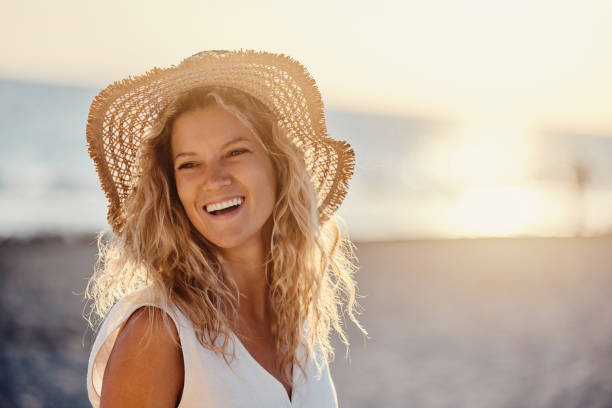istock Young happy woman with sun hat on the beach. 1436031278