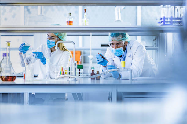 istock Two biotechnologists working on antiviral drug in laboratory. 1436032021