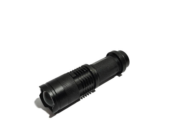 istock Small LED flashlight that usually used for camping, hiking, or any outdoor activities 1436032113