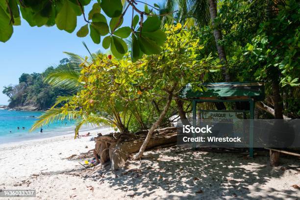 Wooden Sign On The Sandy Tropical Beach At Manuel Antonio National Park Quepos Costa Rica Stock Photo - Download Image Now
