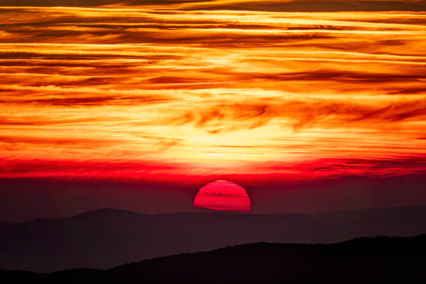 Big red setting sun stock photo
