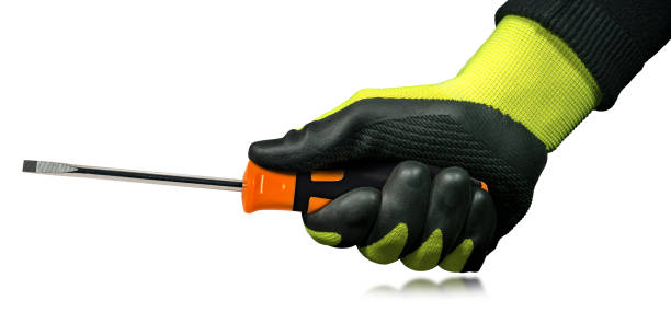 istock Manual Worker with Protective Work Gloves Holding a Flat Head Screwdriver 1436035443