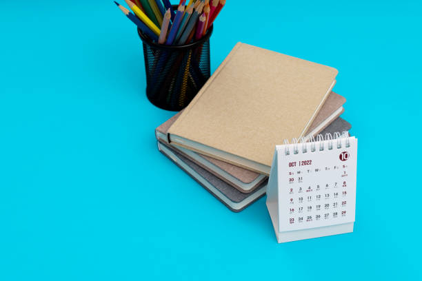 istock Calendar with books on blue background 1436035566
