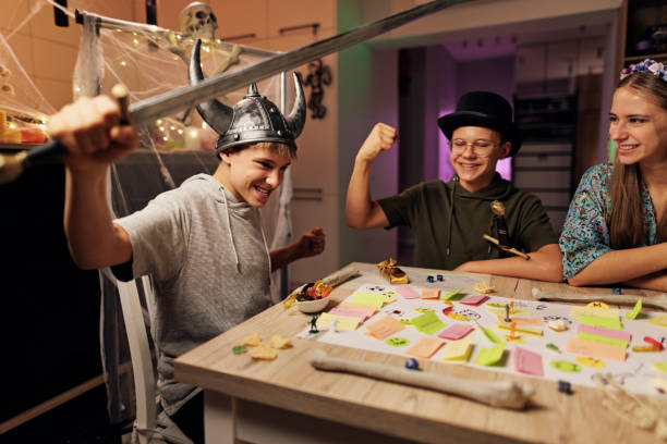 istock Family playing custom board / RPG game together at home. 1436036726