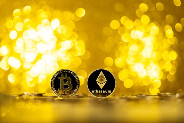 Ethereum and Bitcoin cryptocurrency on shiny background Fujian, China - December 29, 2021: Ethereum and Bitcoin cryptocurrency on shiny background. ethereum stock pictures, royalty-free photos & images