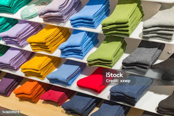 Multi Colored Socks Stacked On Shelves In The Store Stock Photo - Download Image Now