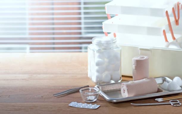 Bandage, home first aid kit on table, blurred background stock photo