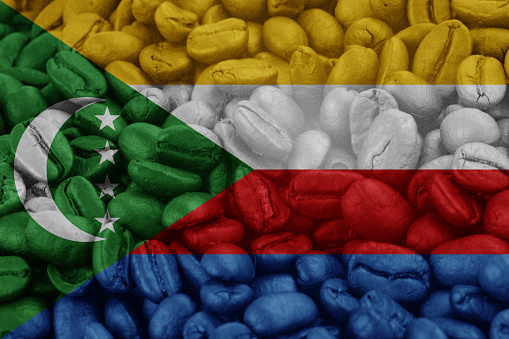 Comoros Flag on background coffee beans