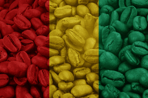 Guinea Flag on background coffee beans