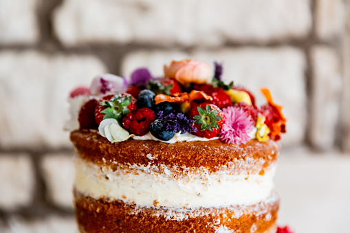 Wedding Victoria sponge cake with fruit and flowers