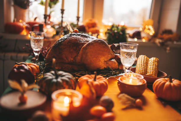 istock Thanksgiving holiday dinner table setting with fall decoration and pumpkins 1436042628