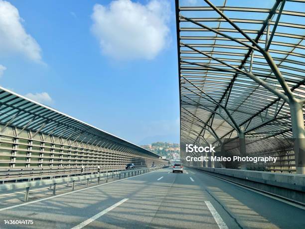 Traffic On Swiss Highway With Noise Barrier Close To Border Crossing Como Chiasso Italy Stock Photo - Download Image Now