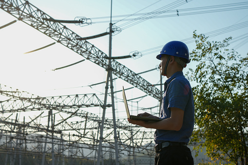 Electricity engineer inspects and inspects lines