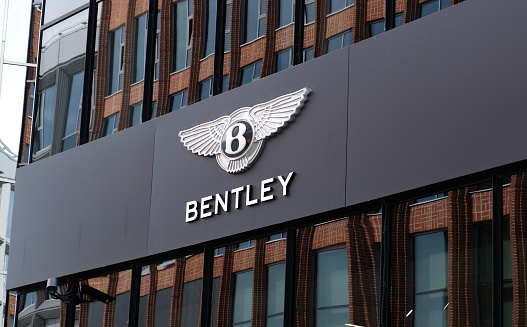 Bentley logo on facade building of dealer office in Tallinn, Estonia - June, 2022. Showroom of a brand. Bentley Motors Limited is a British luxury automaker.
