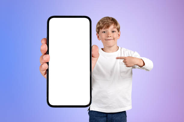 istock Child finger pointing at smartphone big mockup screen on gradient background 1436050697