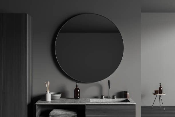 istock Grey bathroom interior with sink and mirror, accessories on deck 1436050867