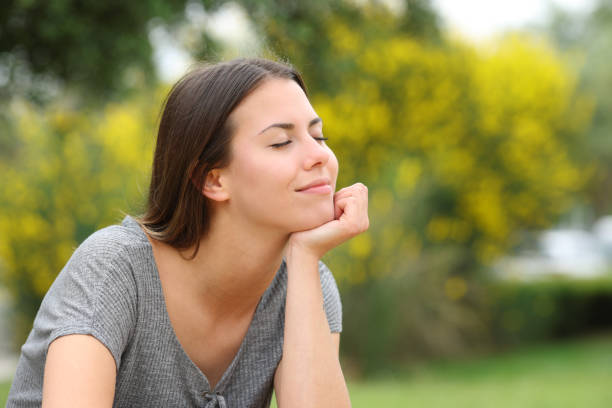 istock Satisfied teen relaxing in a park 1436054361