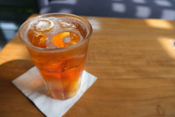 istock A glass of ice tea with napkin on table with copy space 1436054576