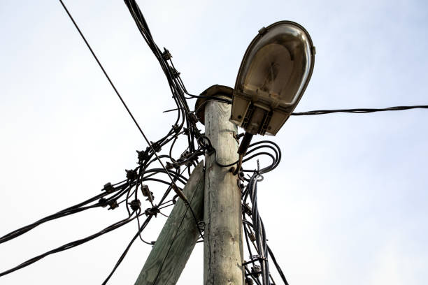 istock Street lighting on a pole. Electrical wires, cables and communications 1436054677