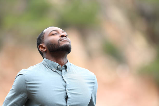 istock Black man breathing fresh air outside 1436054798