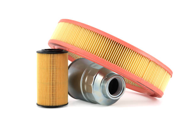 Round air filter, fuel and oil filters isolated on a white stock photo