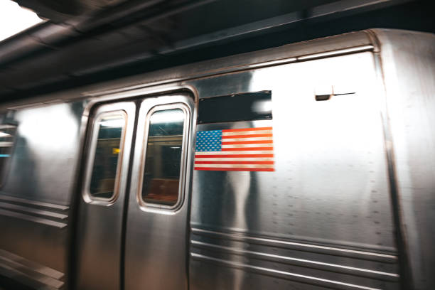 istock NYC subway train departing from a subway station 1436057821
