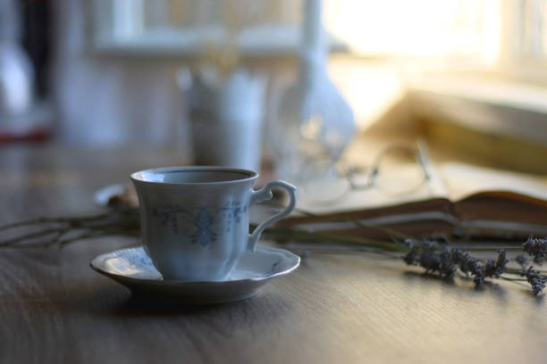 istock Tea, Cookies, Book, Candles and Lavender 1436058591
