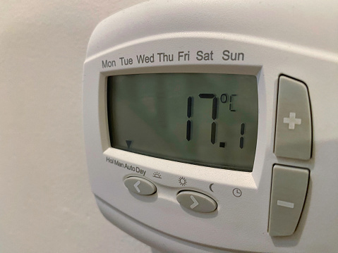 Photograph of a central heating thermostats on a wall