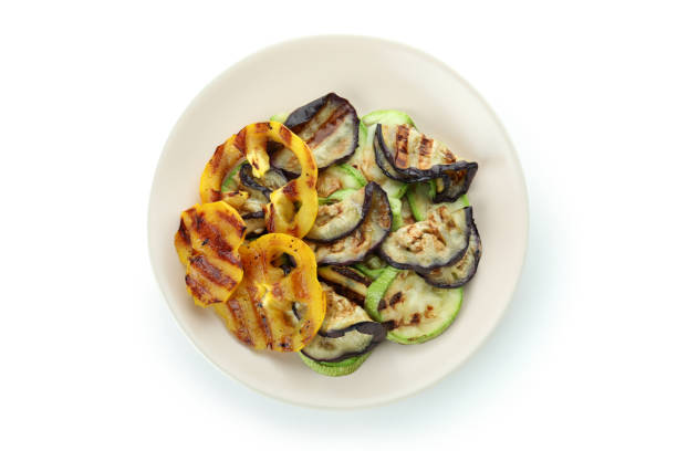 istock Plate with grilled vegetables isolated on white background 1436060842