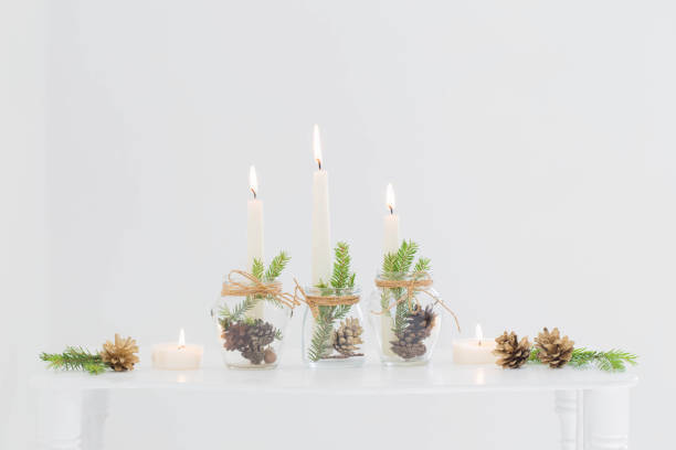 istock home christmas decor with burning candles in whte interior 1436062347