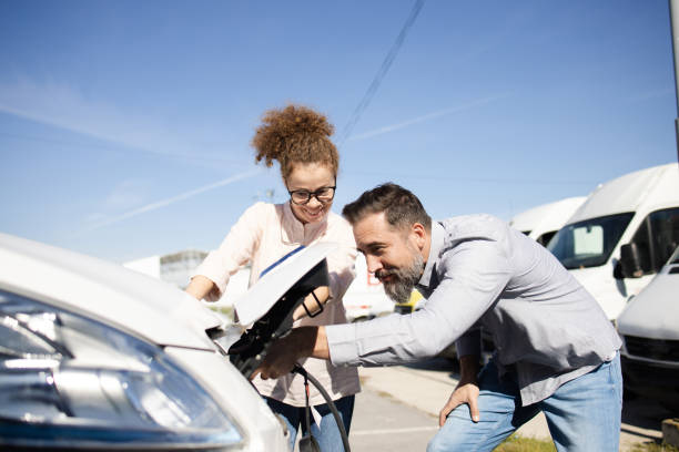 istock Happy couple on a journey  charging their electric van 1436063815