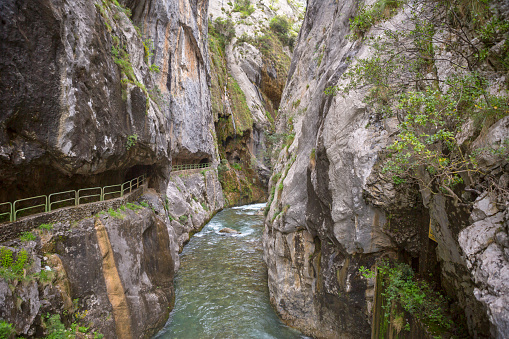 Entrance of the hiking trail Ruta del Cares along river Cares in Cain, Picos de Europa National Park, Leon, Spain.