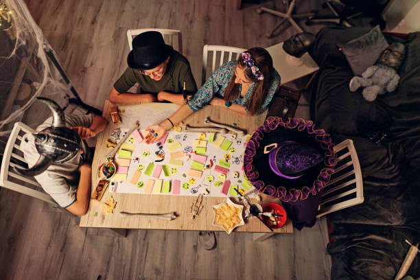 Closeup: dices at the table with Board game. Gameplay moments. Random game concept, toned photo.