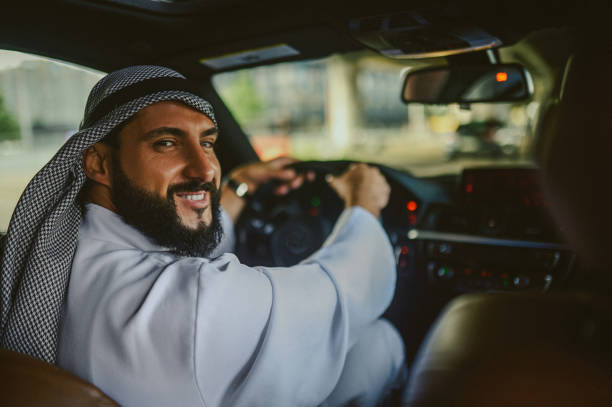 istock Saudi man driving a car and feeling good 1436064262