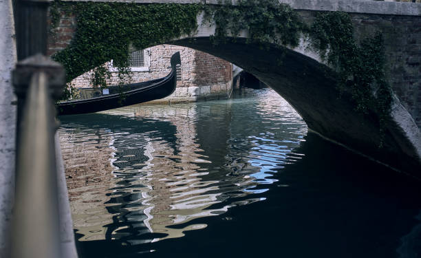 istock Venice canal with a floating gondola front part with ferro 1436068056