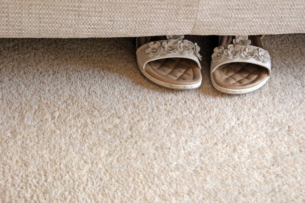 istock Beige sandals and carpet 1436068260