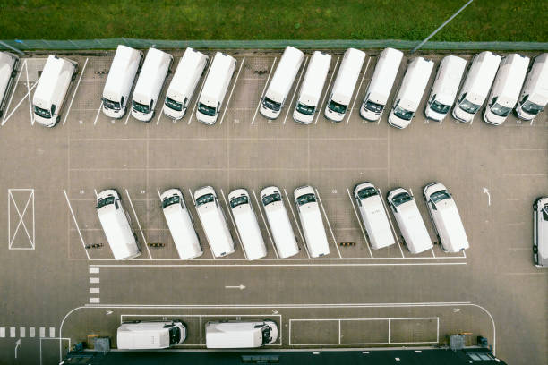 istock Delivery vans parked at a distribution warehouse 1436068913