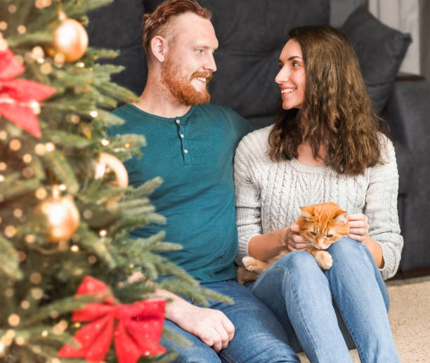 istock young couple and ginger cat 1436070535