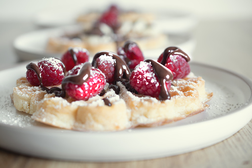 Dessert waffles with raspberries and bananas