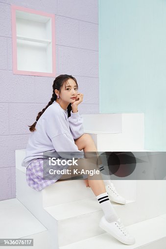 istock Cute portrait of a young Asian woman in sporty fashion 1436076117