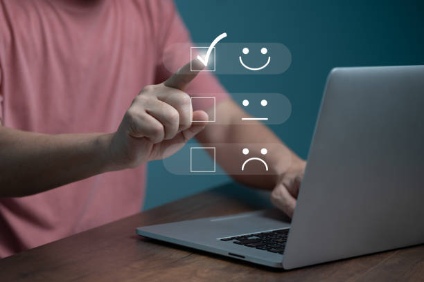 istock Customer service satisfaction concept ,Business people are touching the virtual screen on the happy Smiley face icon to give satisfaction in service. rating very impressed. 1436077789