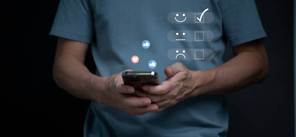 istock Customer review satisfaction feedback survey, User give rating to service experience on online application, Customer hands press like and love icon on mobile phone. 1436077984