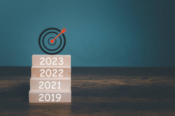 istock 2023 New Year goals setting on wooden box and Target Logo with copy space on the table. 1436078096
