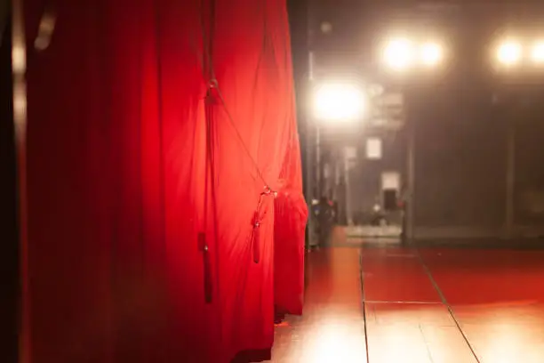 theater scene behind the red curtain