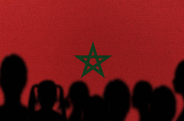 silhouette people with moroccan flag - moroccan flag imagens e fotografias de stock