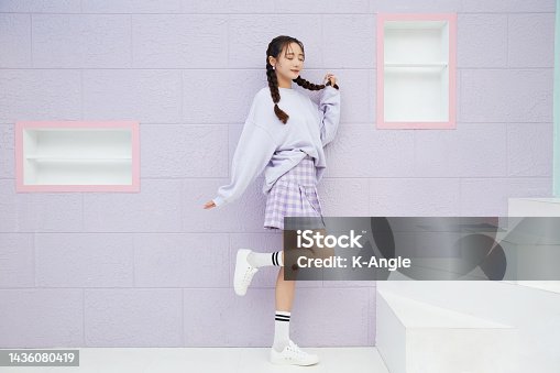 istock Cute portrait of a young Asian woman in sporty fashion 1436080419