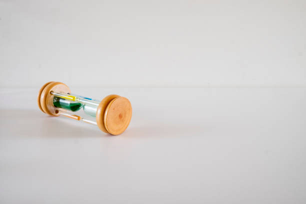 istock An hourglass with four glass cylinders and different colored sand. 1436081363