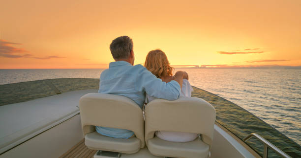 istock Couple driving yacht 1436081801