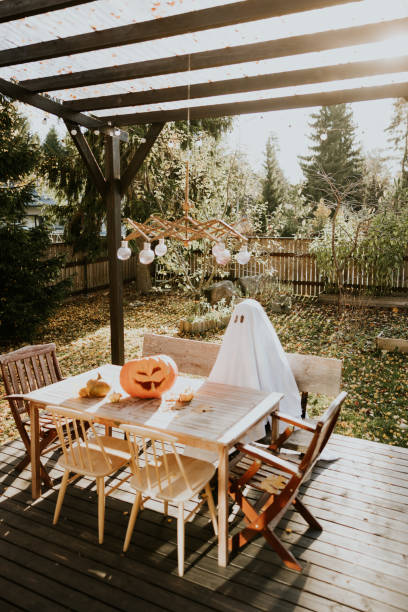istock Lonely ghost sitting on the porch during Halloween 1436082786