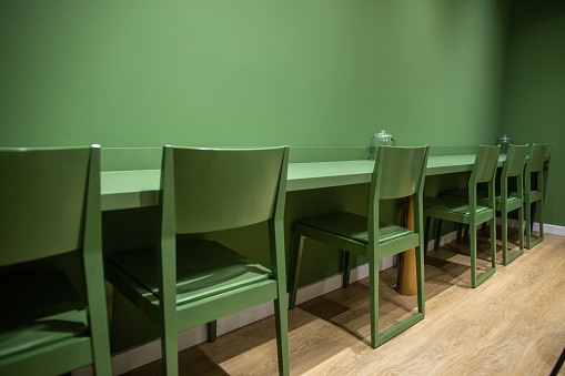 Green chairs on a hardwood floor